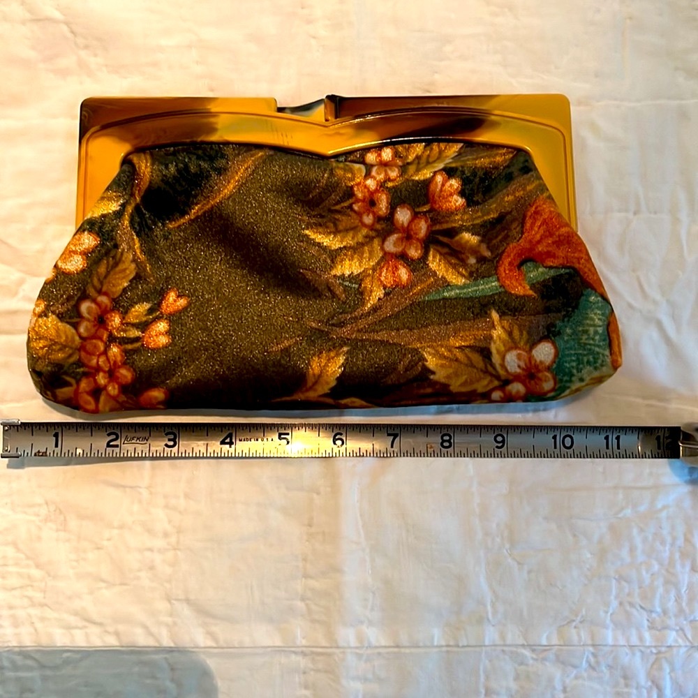 Vintage fabric clutch with celluloid handle. Fabric features tropical theme